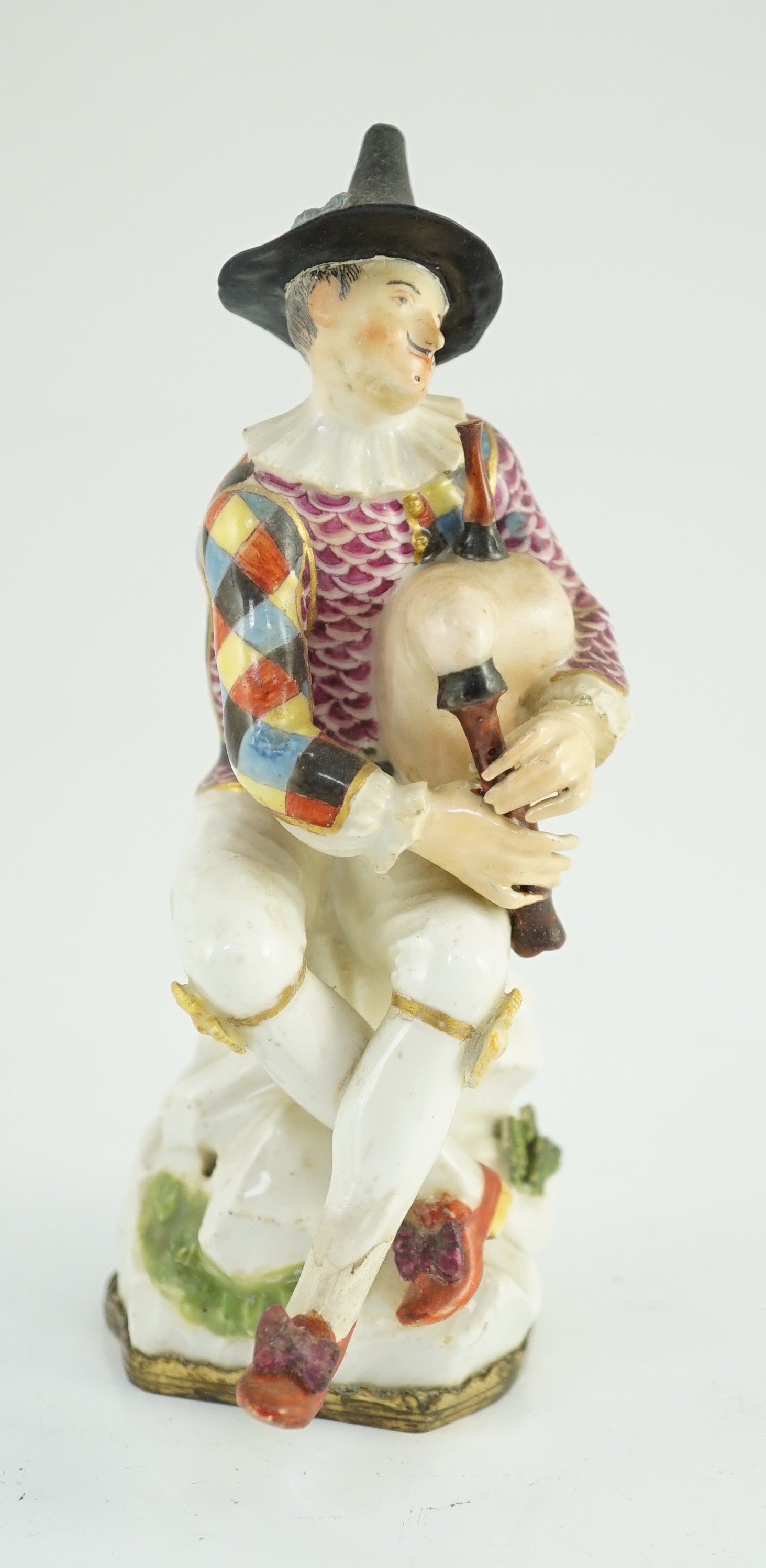 A Meissen porcelain figure of a seated bagpiper, mid 18th century, modelled by J.J. Kandler, 15cm high, restored, Provenance - purchased from Winifred Williams, Eastbourne/London before 1970.